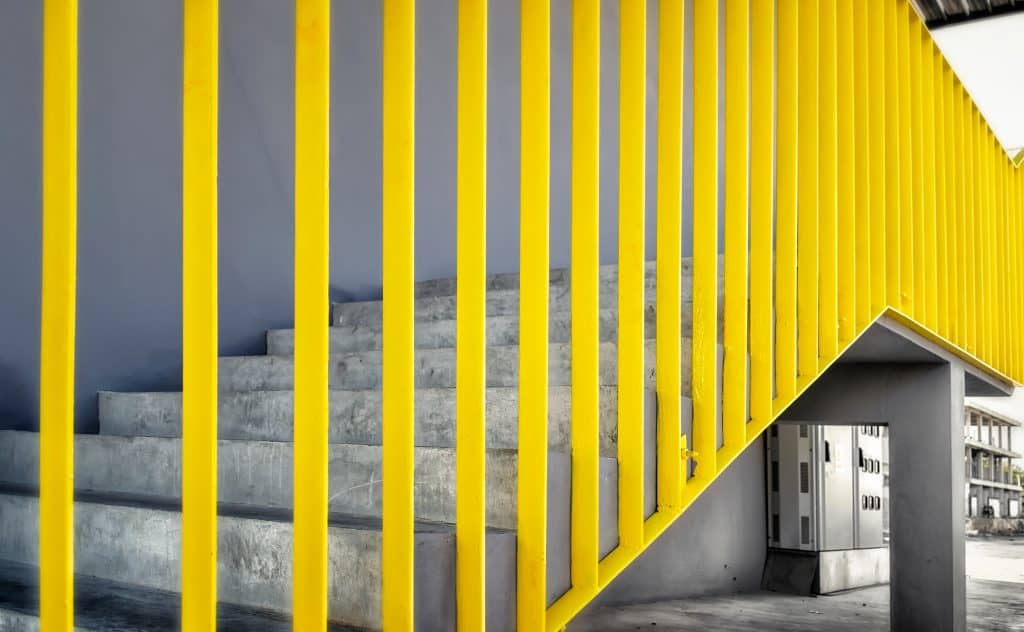 Painted Yellow Guard Rails on a Staircase mci cortec coatings